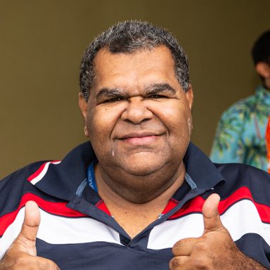 Man with thumbs up gesture