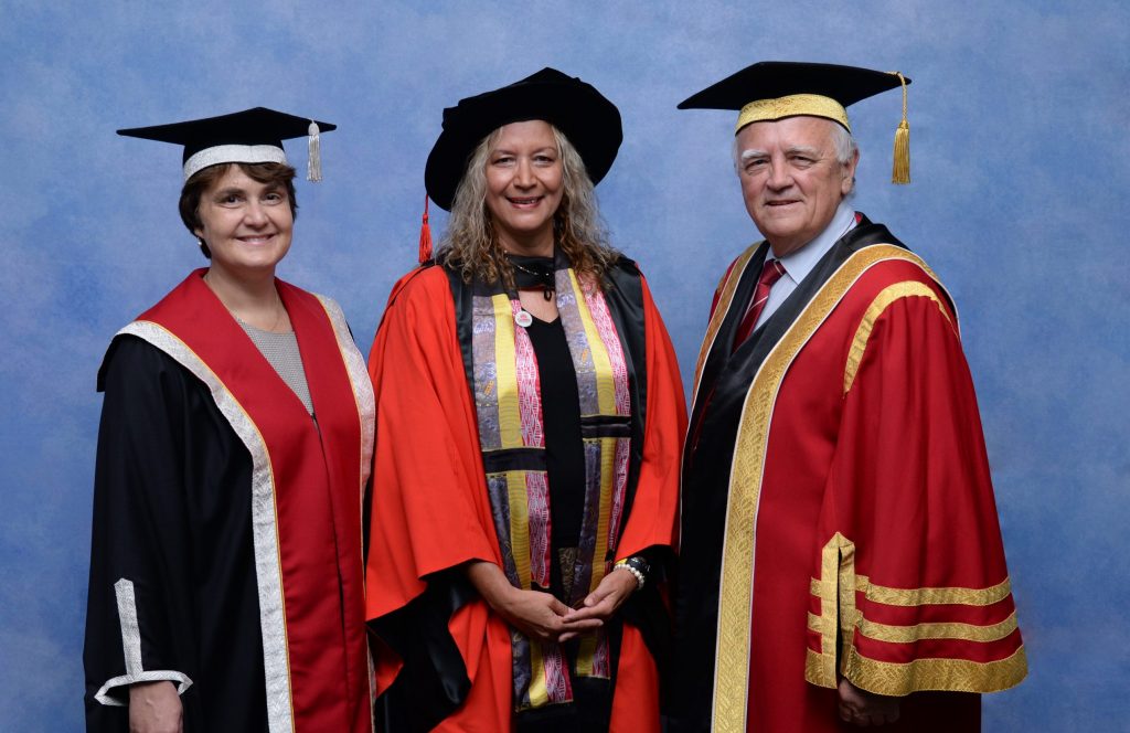 Three people in academic dress