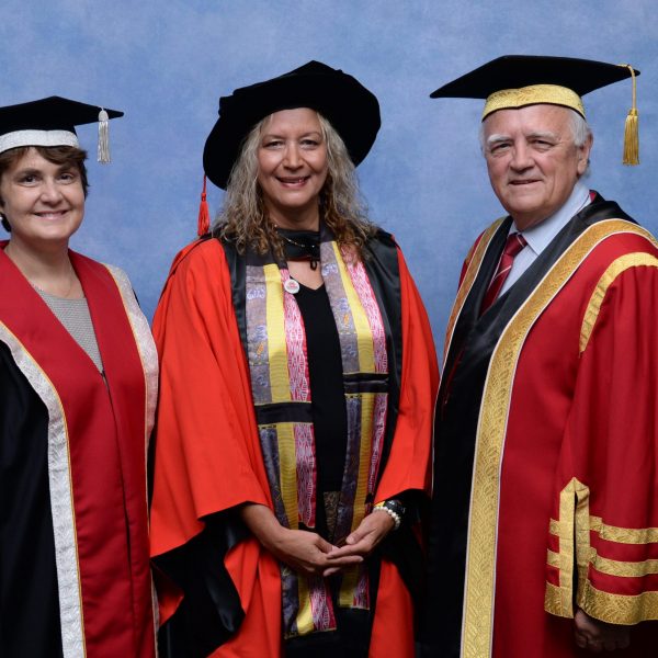 Three people in academic dress