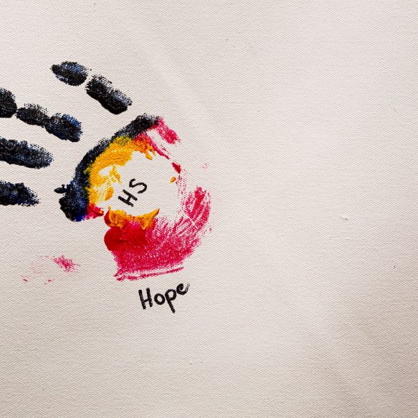 Paint handprint with word Hope underneath