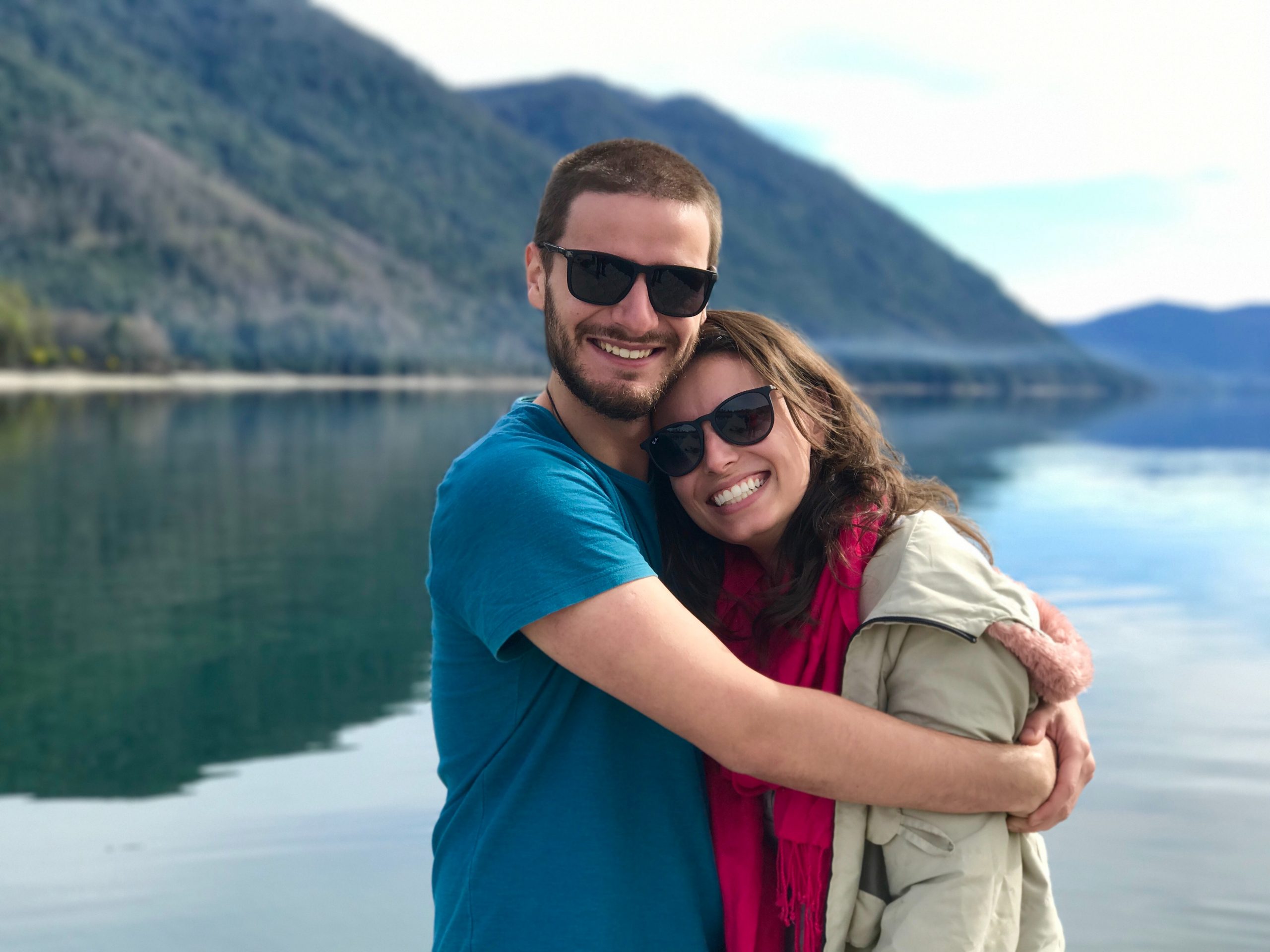 couple hugging at a lake