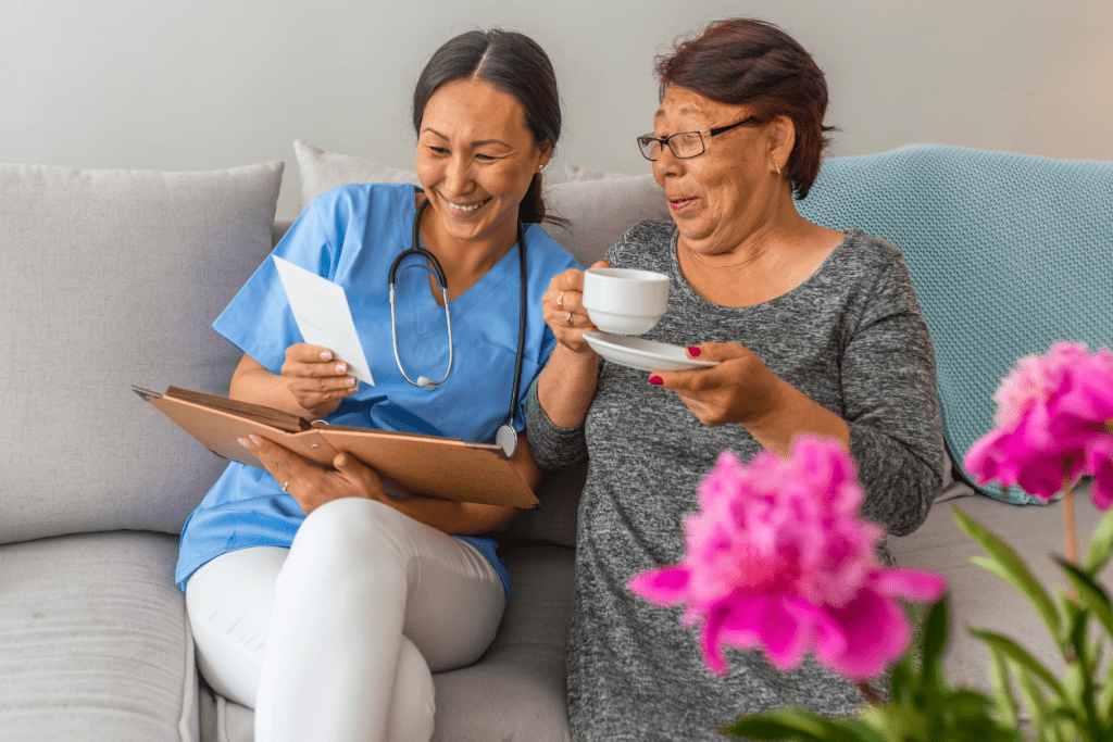 Carer with Individual Connecting with Tea and Photos