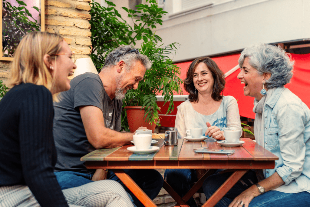 A group of friends with brain injury having coffee 